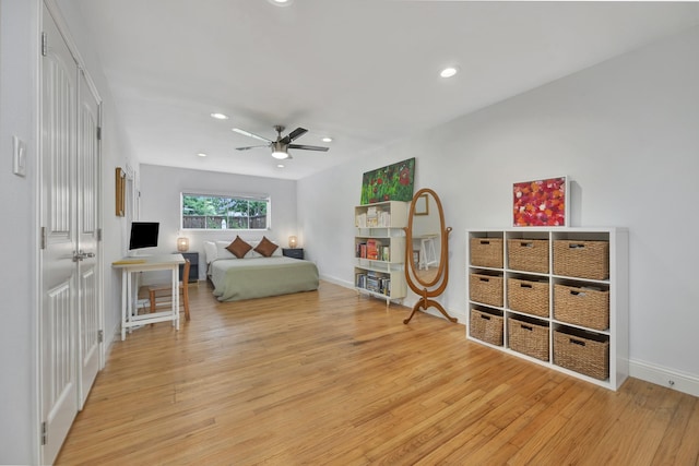 bedroom with light wood-style floors, recessed lighting, baseboards, and a ceiling fan