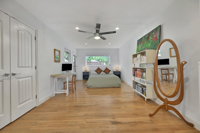 bedroom featuring light wood finished floors, recessed lighting, baseboards, and ceiling fan