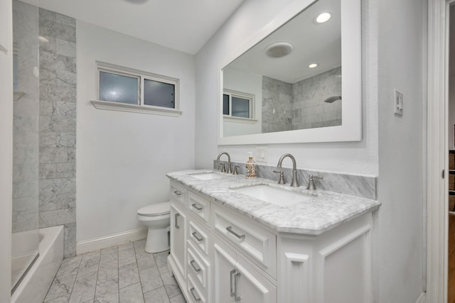 bathroom with marble finish flooring, toilet, double vanity, baseboards, and recessed lighting