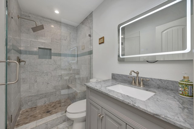 full bath featuring toilet, a shower stall, vanity, and recessed lighting