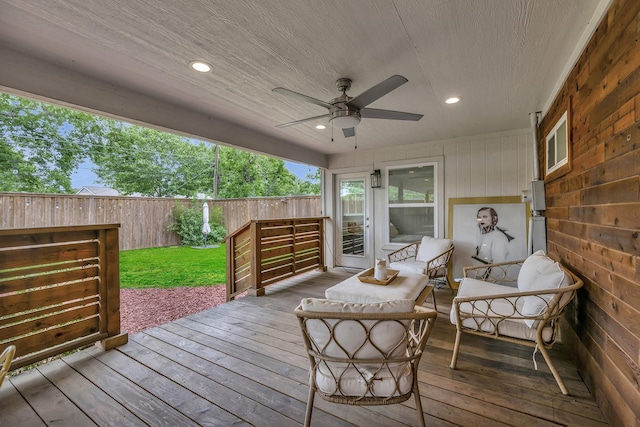 wooden deck featuring a ceiling fan and fence