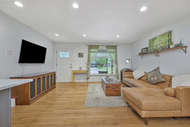 living area with recessed lighting and light wood-type flooring