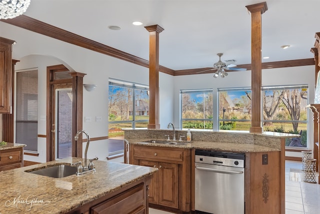 kitchen with a sink, ceiling fan, and ornamental molding