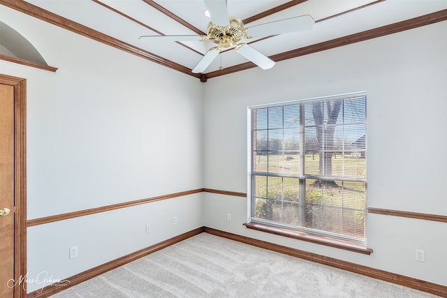 unfurnished room featuring a ceiling fan, baseboards, light carpet, and ornamental molding