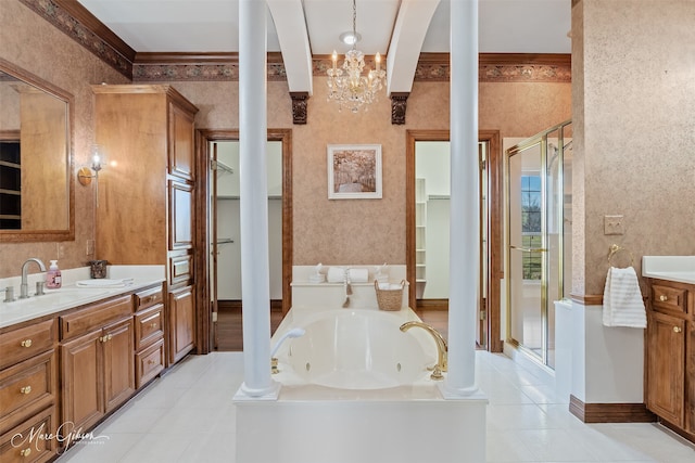 bathroom with vanity, ornate columns, tile patterned flooring, and a stall shower
