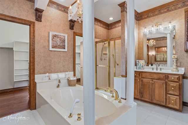full bath featuring a garden tub, ornate columns, tile patterned flooring, and a stall shower