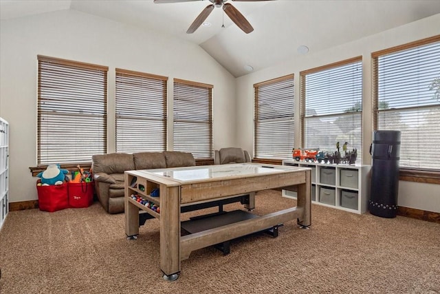 interior space featuring baseboards, ceiling fan, light carpet, and lofted ceiling