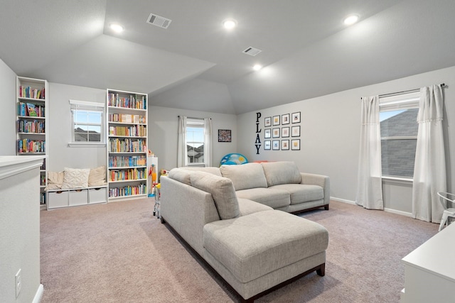 carpeted living area featuring recessed lighting, baseboards, visible vents, and lofted ceiling