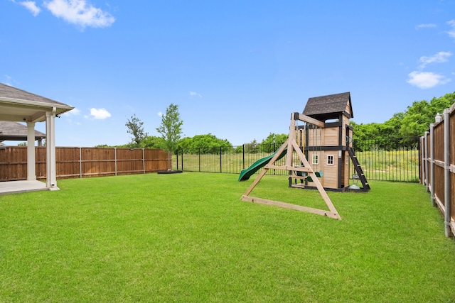 view of play area featuring a yard and a fenced backyard