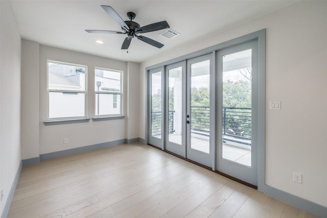 unfurnished room featuring a ceiling fan, visible vents, baseboards, light wood finished floors, and recessed lighting