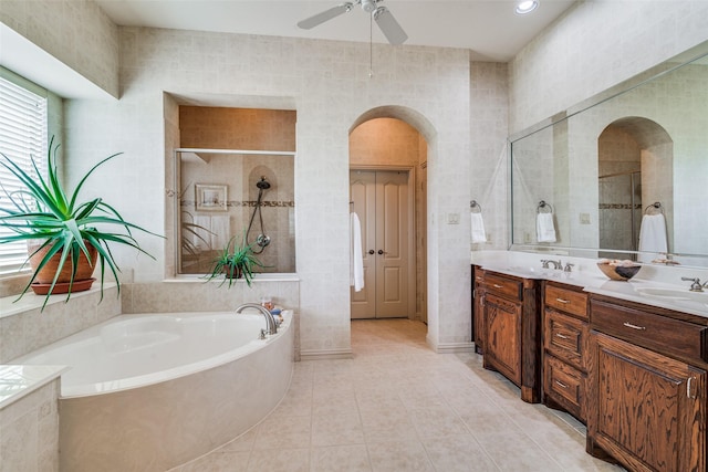 107 Harvest Ridge Cv, Mclendon Chisholm, TX 75032 - full bathroom with tile patterned flooring, double vanity, ceiling fan, a bath, and a tile shower