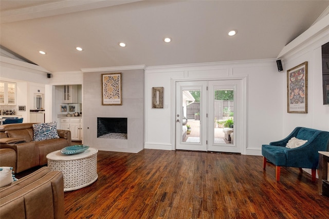 7449 Tophill Ln, Dallas, TX 75248 - living room featuring a large fireplace, dark wood-style floors, vaulted ceiling, ornamental molding, and recessed lighting