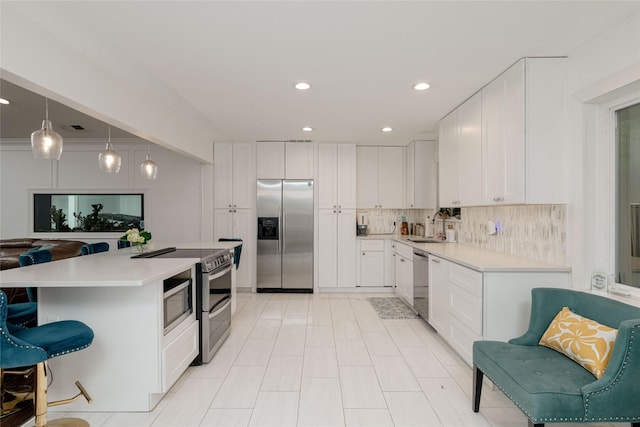 7449 Tophill Ln, Dallas, TX 75248 - kitchen with appliances with stainless steel finishes, a sink, light countertops, white cabinets, and recessed lighting