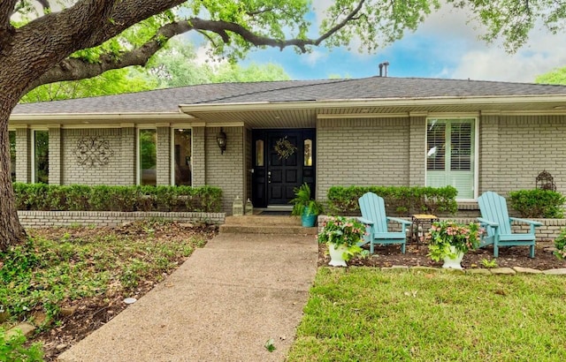 7449 Tophill Ln, Dallas, TX 75248 - view of front facade with brick siding and roof with shingles
