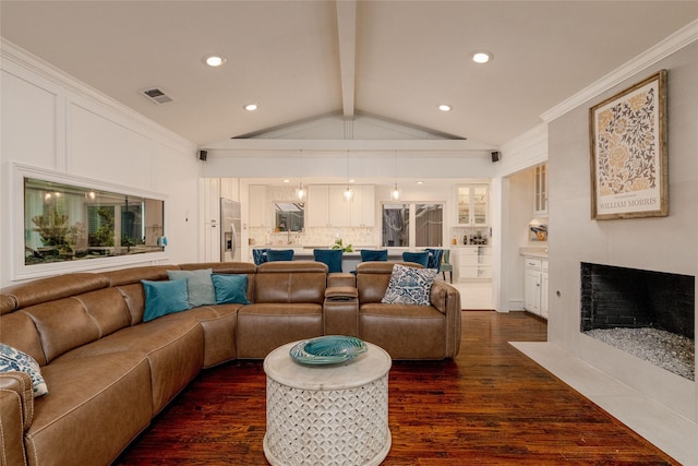 7449 Tophill Ln, Dallas, TX 75248 - living room with dark wood-style flooring, a fireplace with flush hearth, recessed lighting, and ornamental molding