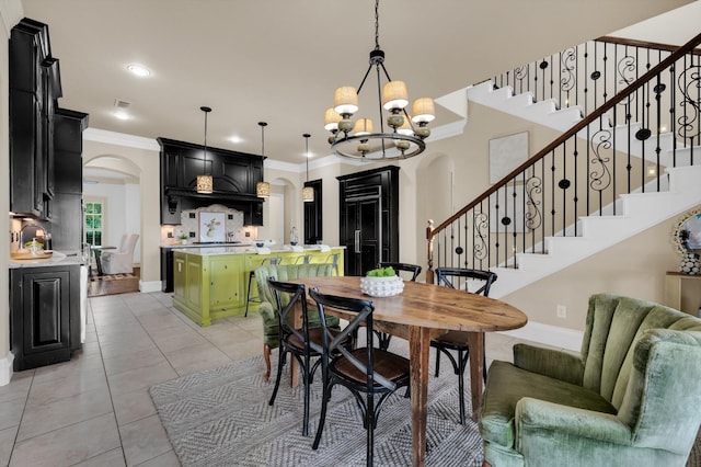7101 Royal Birkdale Dr, Cleburne, TX 76033 - kitchen with green cabinets, built in appliances, baseboards, ornamental molding, and hanging light fixtures