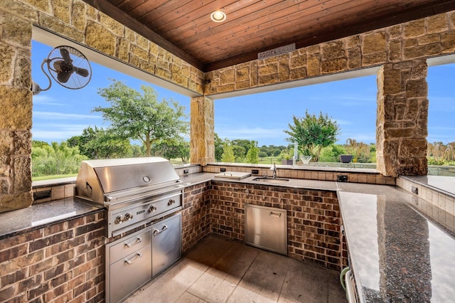 7101 Royal Birkdale Dr, Cleburne, TX 76033 - view of patio featuring fence, outdoor dining space, ceiling fan, a deck, and an outdoor stone fireplace