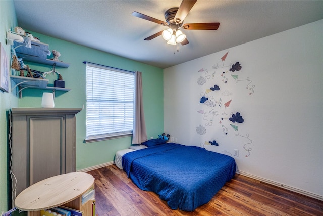 4604 Valleyview Dr, Mansfield, TX 76063 - bedroom with wood finished floors, ceiling fan, and baseboards