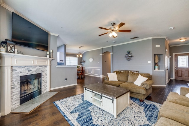 4604 Valleyview Dr, Mansfield, TX 76063 - living room featuring crown molding, ceiling fan, a fireplace, wood finished floors, and baseboards