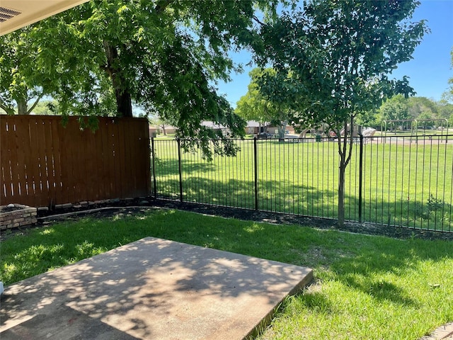 view of yard with a patio and fence