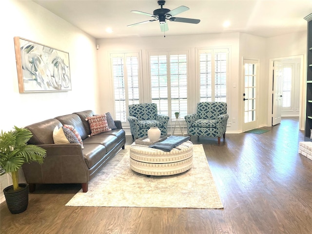 living area featuring a ceiling fan, baseboards, recessed lighting, and dark wood-style floors