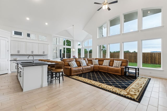 1520 Rough Rider Ct, Celina, TX 75009 - living area with light wood finished floors, recessed lighting, a ceiling fan, and high vaulted ceiling