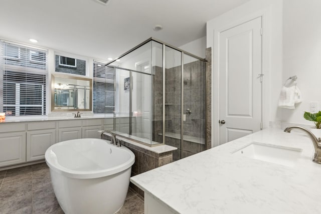 1520 Rough Rider Ct, Celina, TX 75009 - full bath with a shower stall, vanity, tile patterned floors, a soaking tub, and recessed lighting