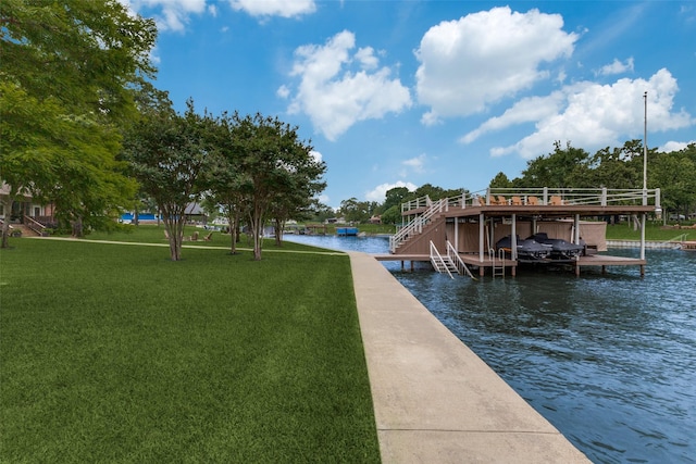 view of dock featuring a yard, a water view, and boat lift