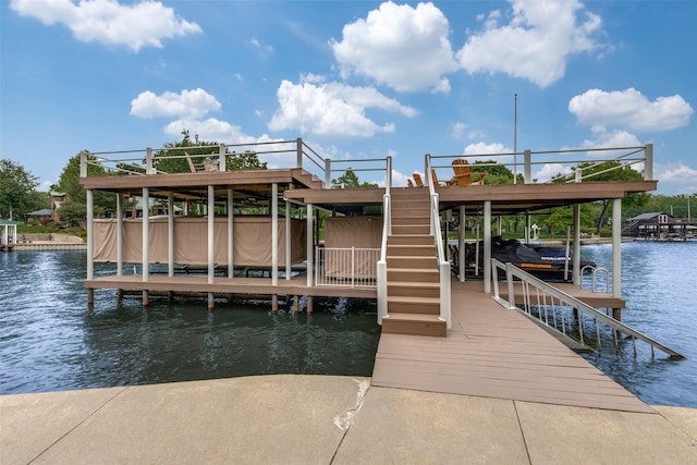 view of dock with boat lift and a water view