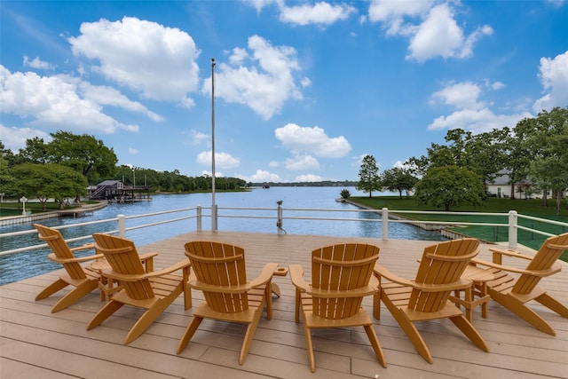 exterior space with a deck with water view