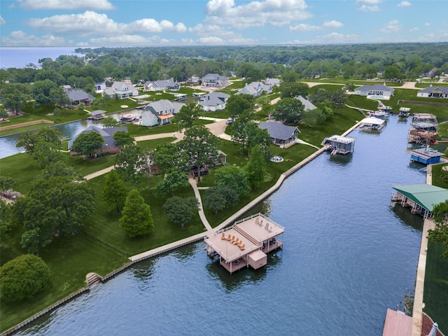 drone / aerial view with a water view and a residential view