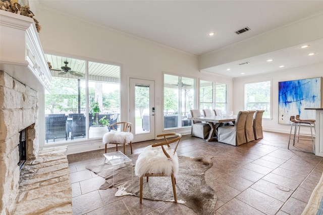 living area with baseboards, ornamental molding, recessed lighting, and visible vents