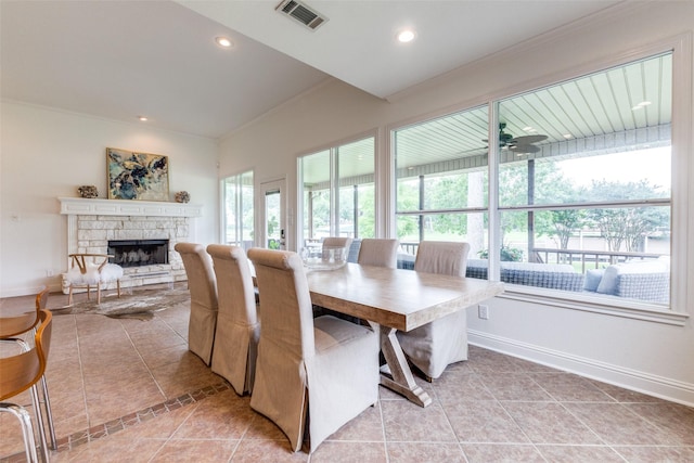 dining space with light tile patterned floors, plenty of natural light, and visible vents
