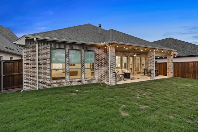 2422 Amesbury Dr, Midlothian, TX 76065 - back of house with brick siding, a patio, a shingled roof, and a ceiling fan