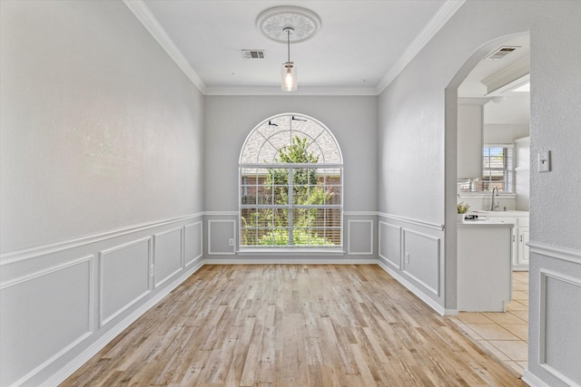 61 Sonora Dr, Trophy Club, TX 76262 - unfurnished dining area with arched walkways, plenty of natural light, and visible vents