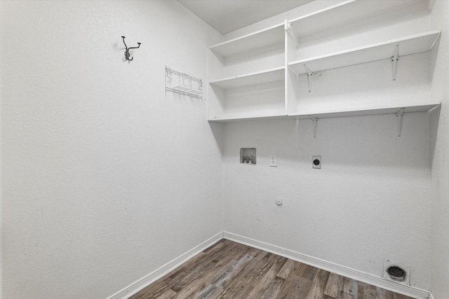 61 Sonora Dr, Trophy Club, TX 76262 - laundry room with laundry area, electric dryer hookup, hookup for a gas dryer, dark wood finished floors, and baseboards