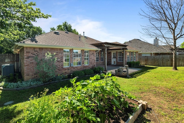 61 Sonora Dr, Trophy Club, TX 76262 - back of property featuring fence, a patio, brick siding, central air condition unit, and a yard
