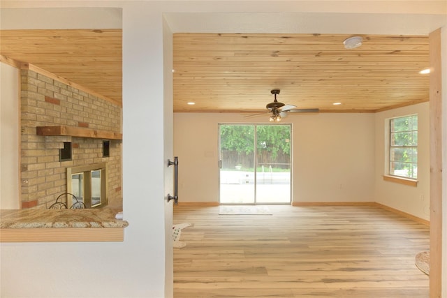 1112 Hillside Dr, Gainesville, TX 76240 - unfurnished living room featuring wooden ceiling, a ceiling fan, and wood finished floors