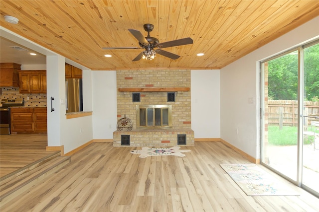 1112 Hillside Dr, Gainesville, TX 76240 - unfurnished living room featuring light wood-style floors, wooden ceiling, ceiling fan, and baseboards