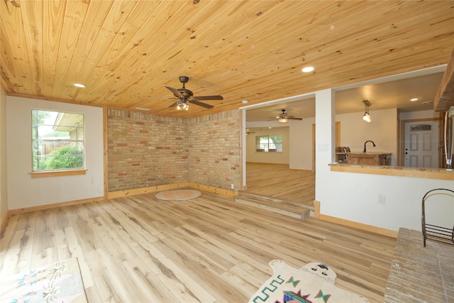 1112 Hillside Dr, Gainesville, TX 76240 - unfurnished living room with wood ceiling, baseboards, a ceiling fan, and wood finished floors