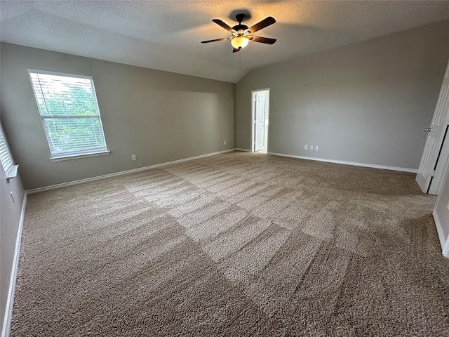 2129 San Simeon Dr, Mesquite, TX 75181 - unfurnished bedroom with carpet floors, baseboards, and lofted ceiling