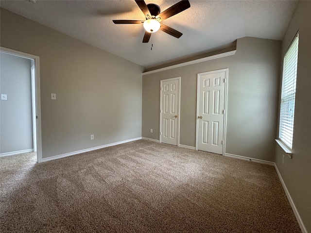 2129 San Simeon Dr, Mesquite, TX 75181 - unfurnished bedroom featuring multiple closets, a textured ceiling, and carpet floors