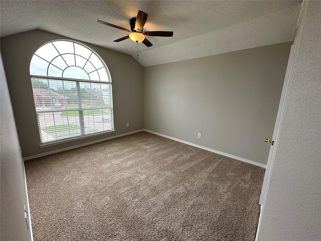 2129 San Simeon Dr, Mesquite, TX 75181 - unfurnished room with carpet floors, a ceiling fan, vaulted ceiling, and a textured ceiling