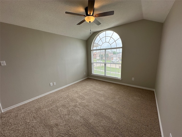 2129 San Simeon Dr, Mesquite, TX 75181 - spare room featuring carpet floors, ceiling fan, vaulted ceiling, and baseboards