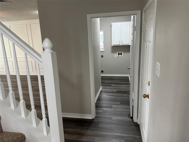 2129 San Simeon Dr, Mesquite, TX 75181 - hall featuring stairway, baseboards, dark wood-style floors, and visible vents