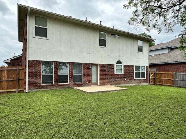 2129 San Simeon Dr, Mesquite, TX 75181 - back of house with a fenced backyard, a patio, a lawn, and brick siding