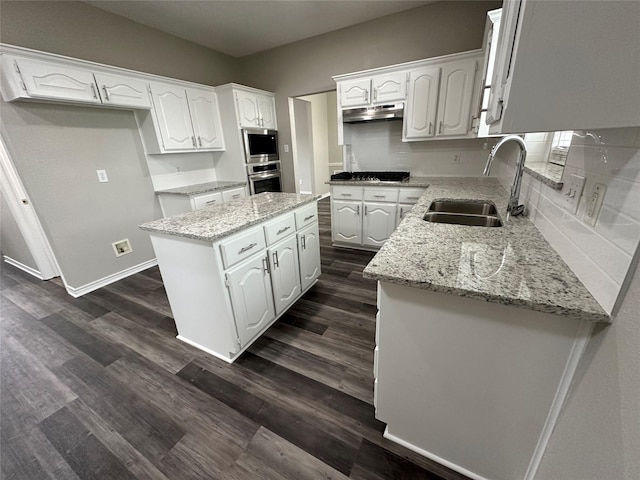 2129 San Simeon Dr, Mesquite, TX 75181 - kitchen featuring a sink, a center island, white cabinets, and under cabinet range hood