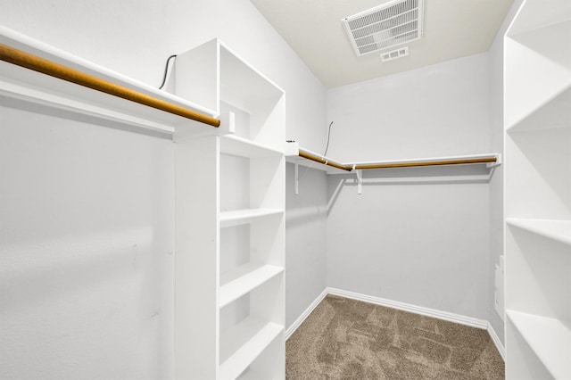 walk in closet with carpet floors and visible vents