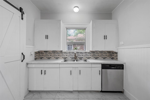 kitchen with a sink, light countertops, white cabinetry, and dishwasher