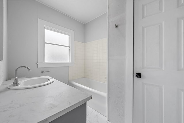 full bath with a tub to relax in and vanity
